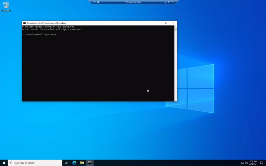 A picture of Windows Sandbox being used. The words "Windows Sandbox" are seen in the top middle of the screen, with a minimize button, a maximize button, and a close button. Inside of the Windows Sandbox is a virtual machine where the Command Prompt is opened.
